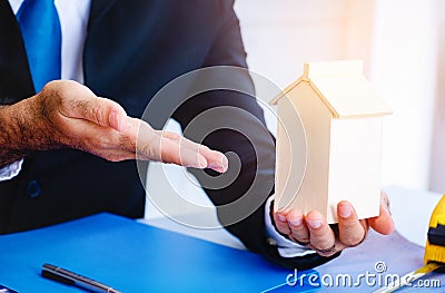 à¸ºBody part.Business man pointing hand in to modal home. Stock Photo